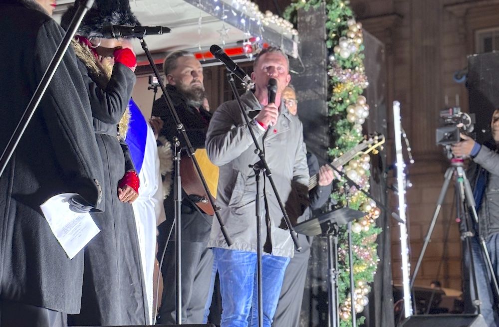 Tommy Robinson on stage at Carol Concert
