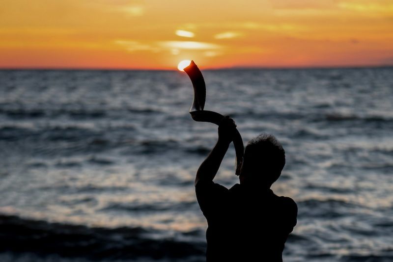 Blowing a shofar